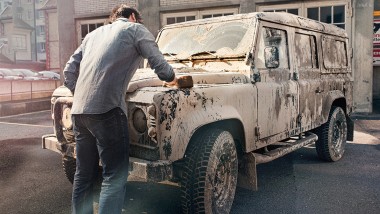 Cleaning with water - man cleans car